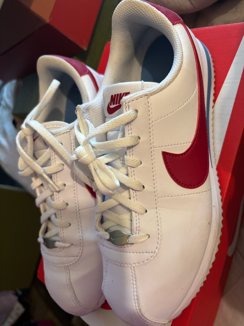Nike Kids White Sneakers with Red Swoosh